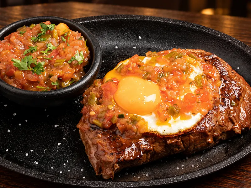 Carne a caballo — Steak topped with a fried egg